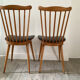 2 chaises baumann assise en simili cuir noir
