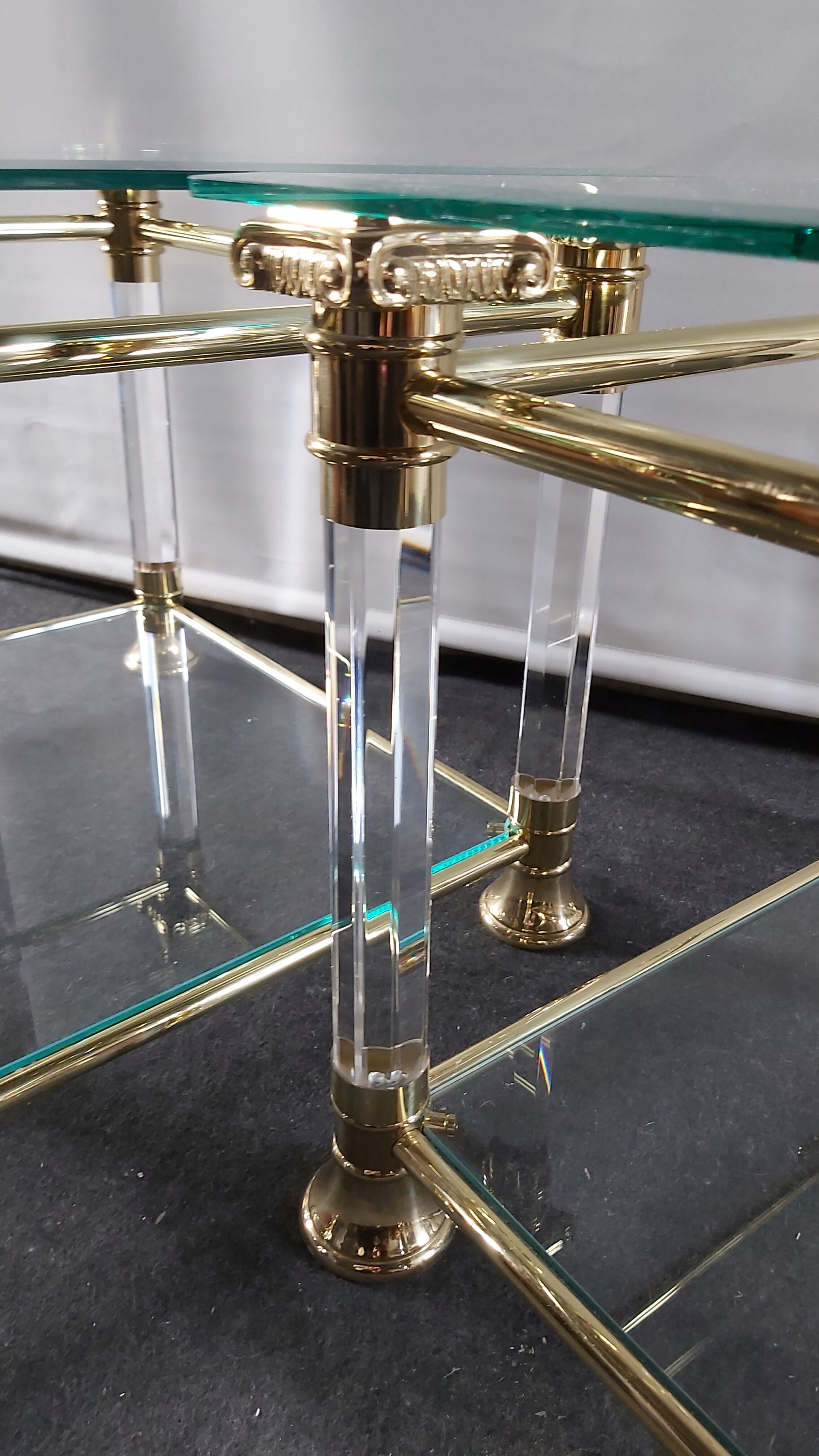 Pair of tables in brass, acrylic and glass