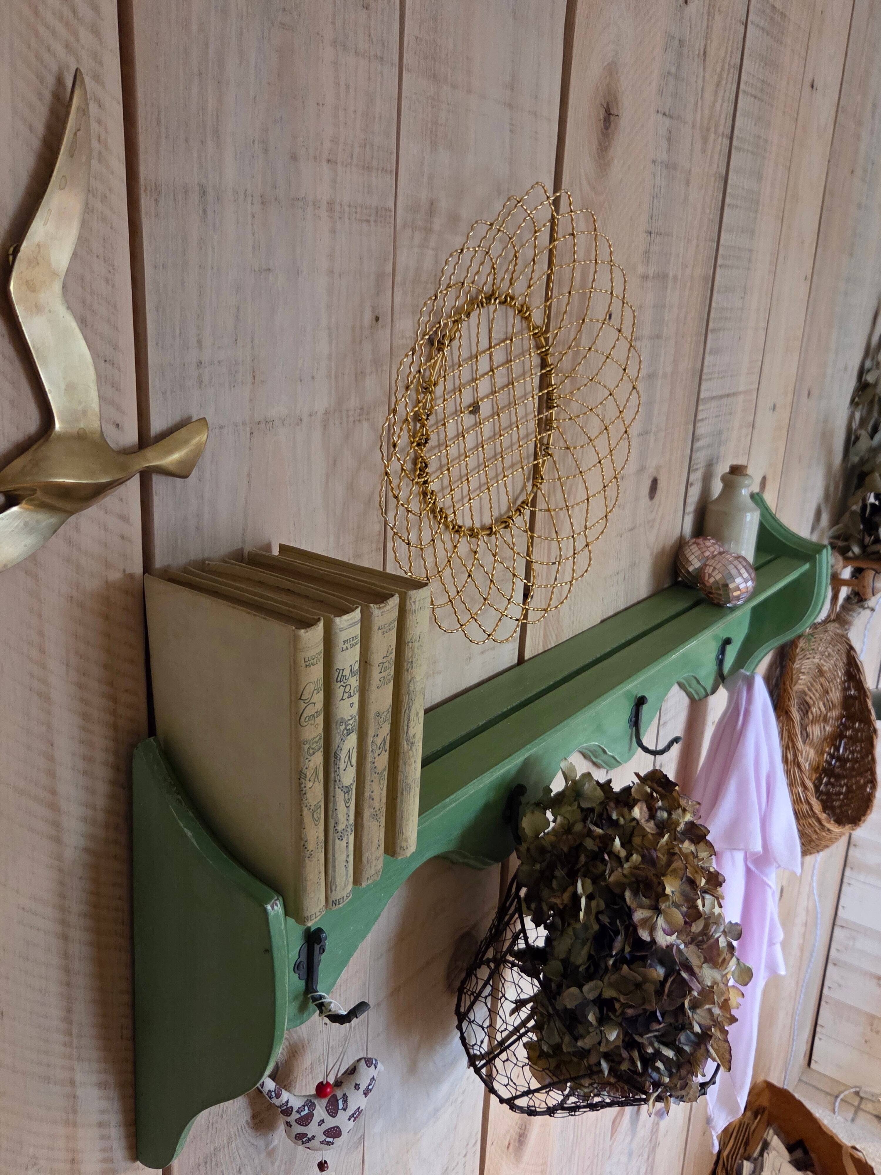 Antique wall shelf with a green patina