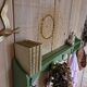 Antique wall shelf with a green patina
