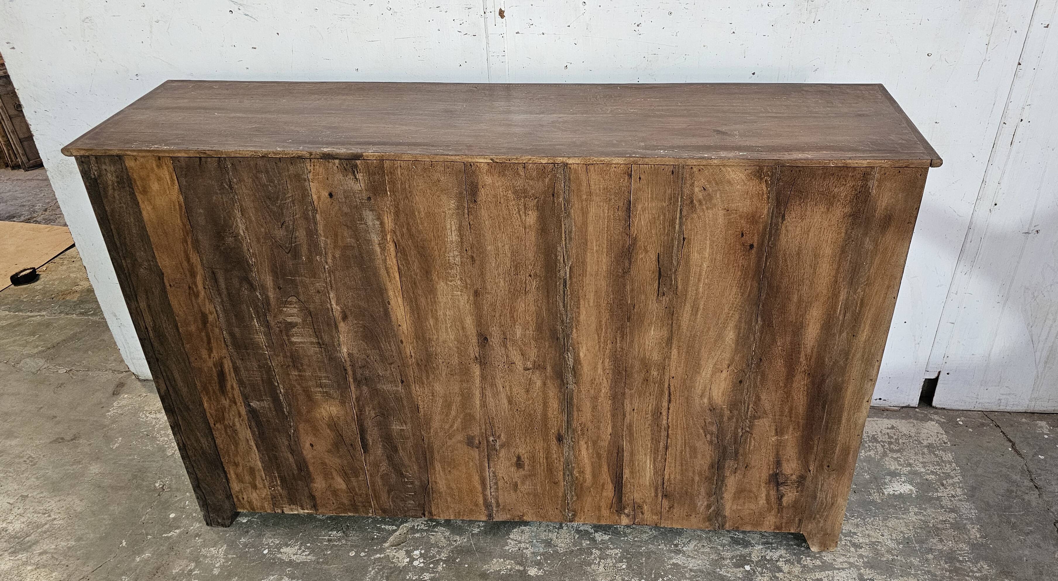 Antique glass-fronted buffet in Burmese teak