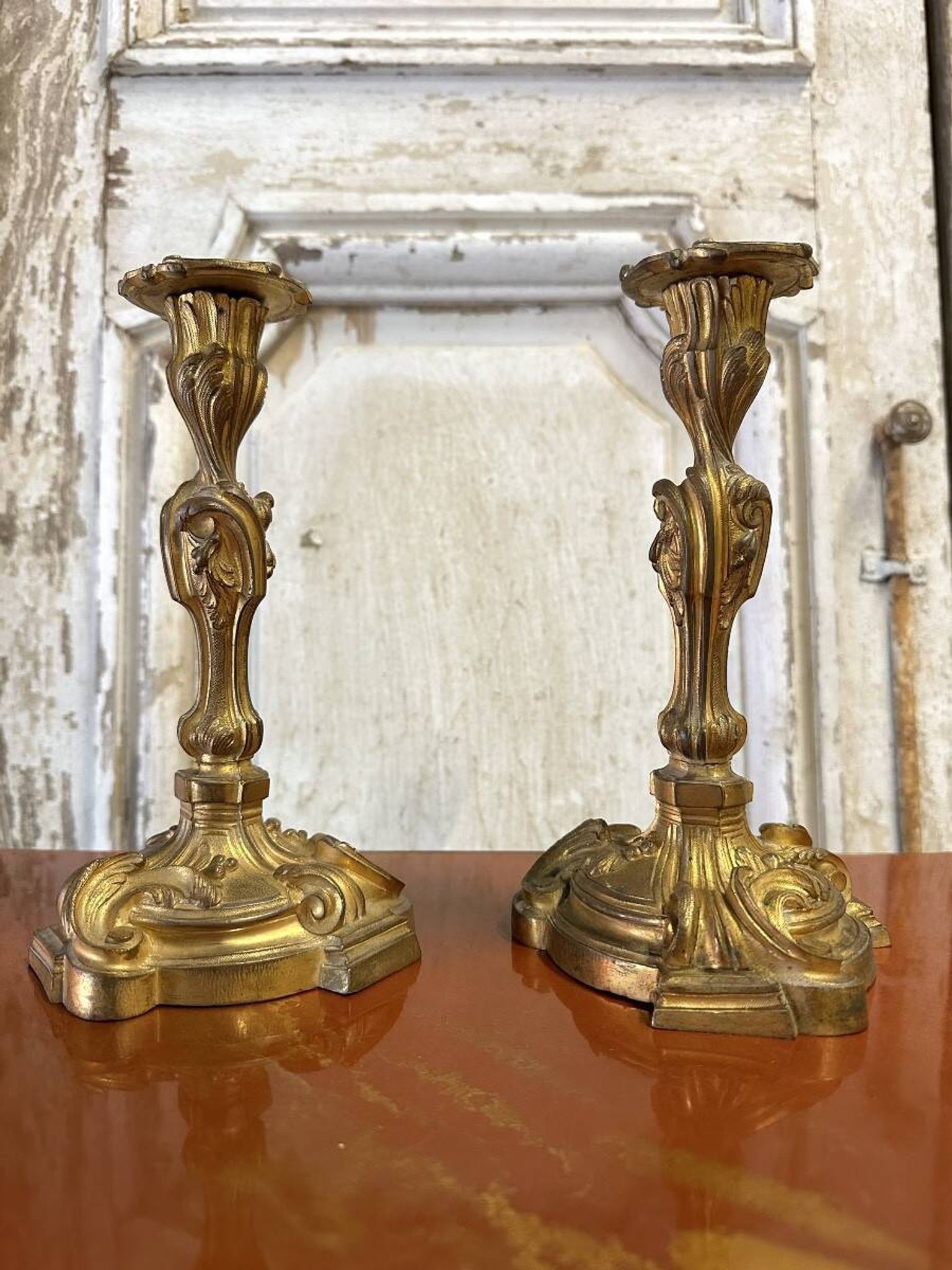 Pair of bronze candlesticks from the early 20th century in Louis XV style.