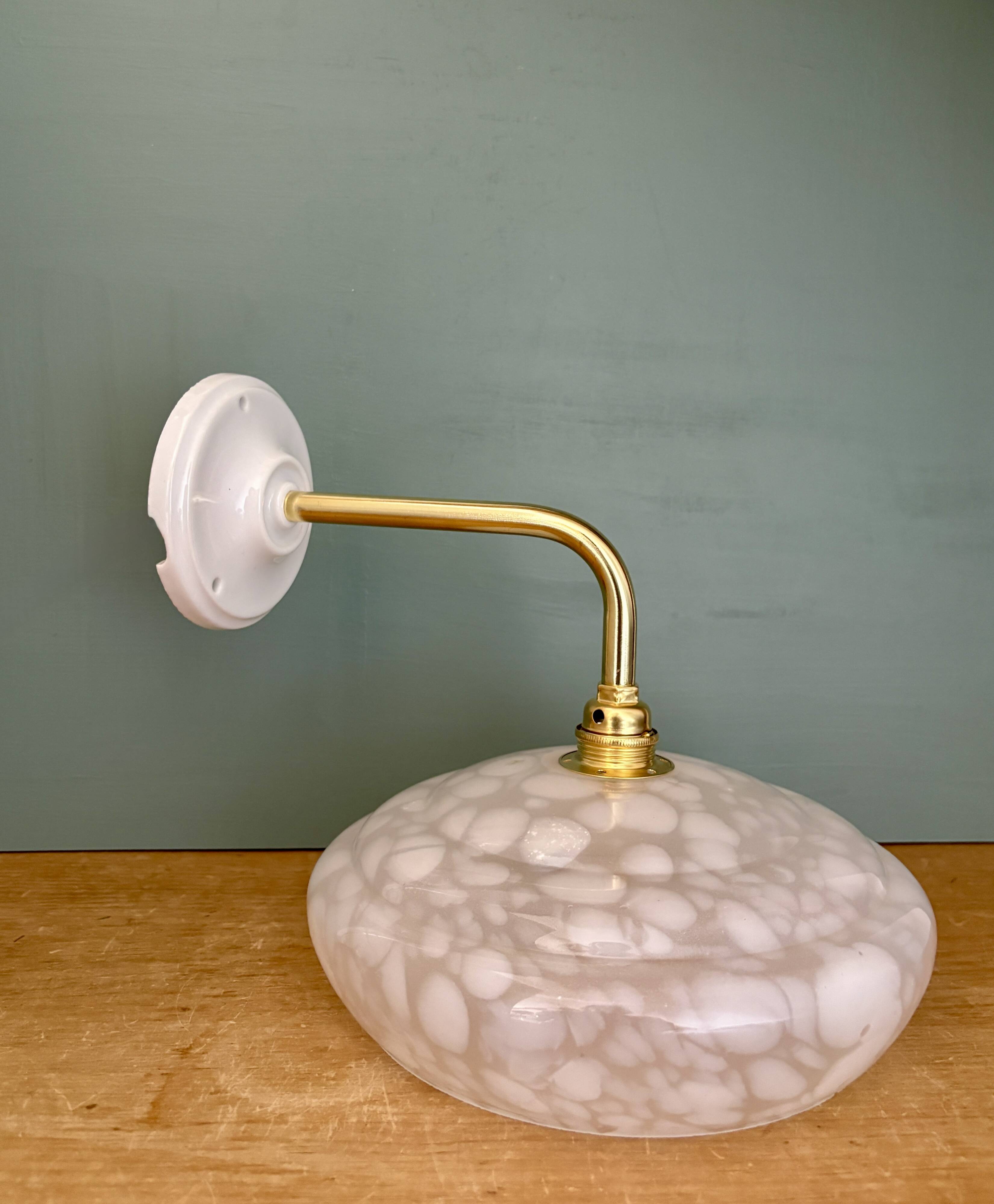 Vintage glass wall lamp with a white Clichy shade.