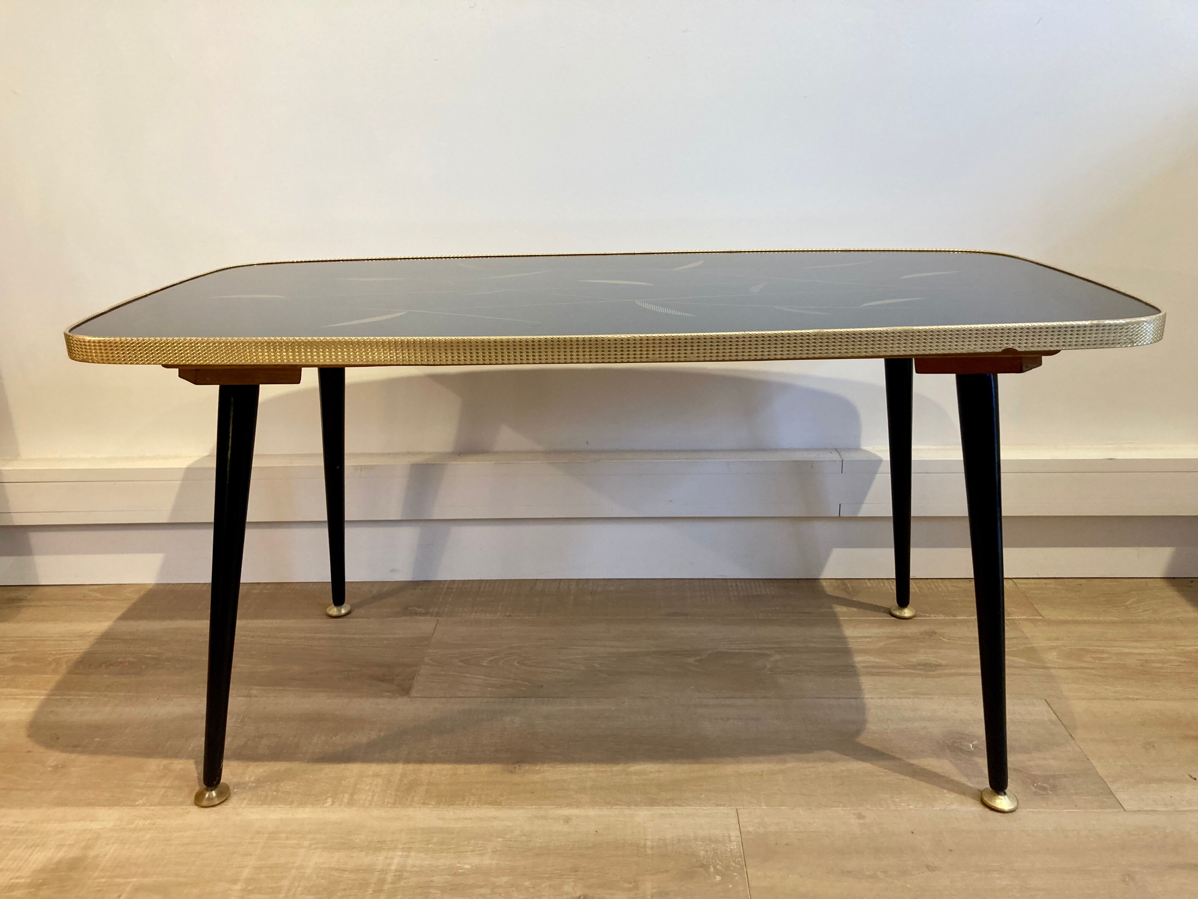 Black glass coffee table wooden legs 60s