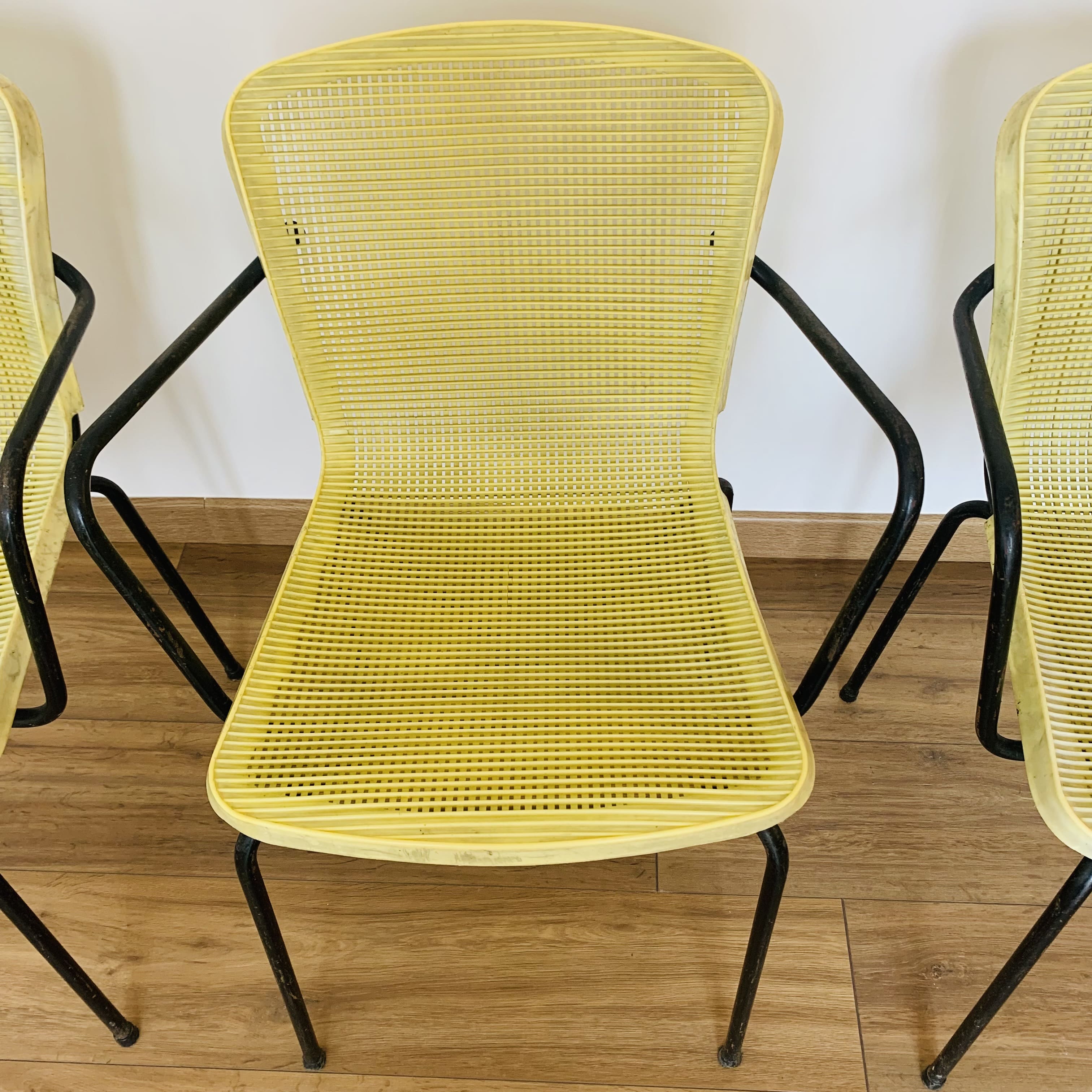 4 yellow outdoor armchairs