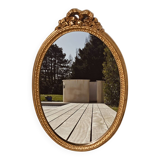 Authentic chic vintage oval mirror, in gilded wood, in baroque style.