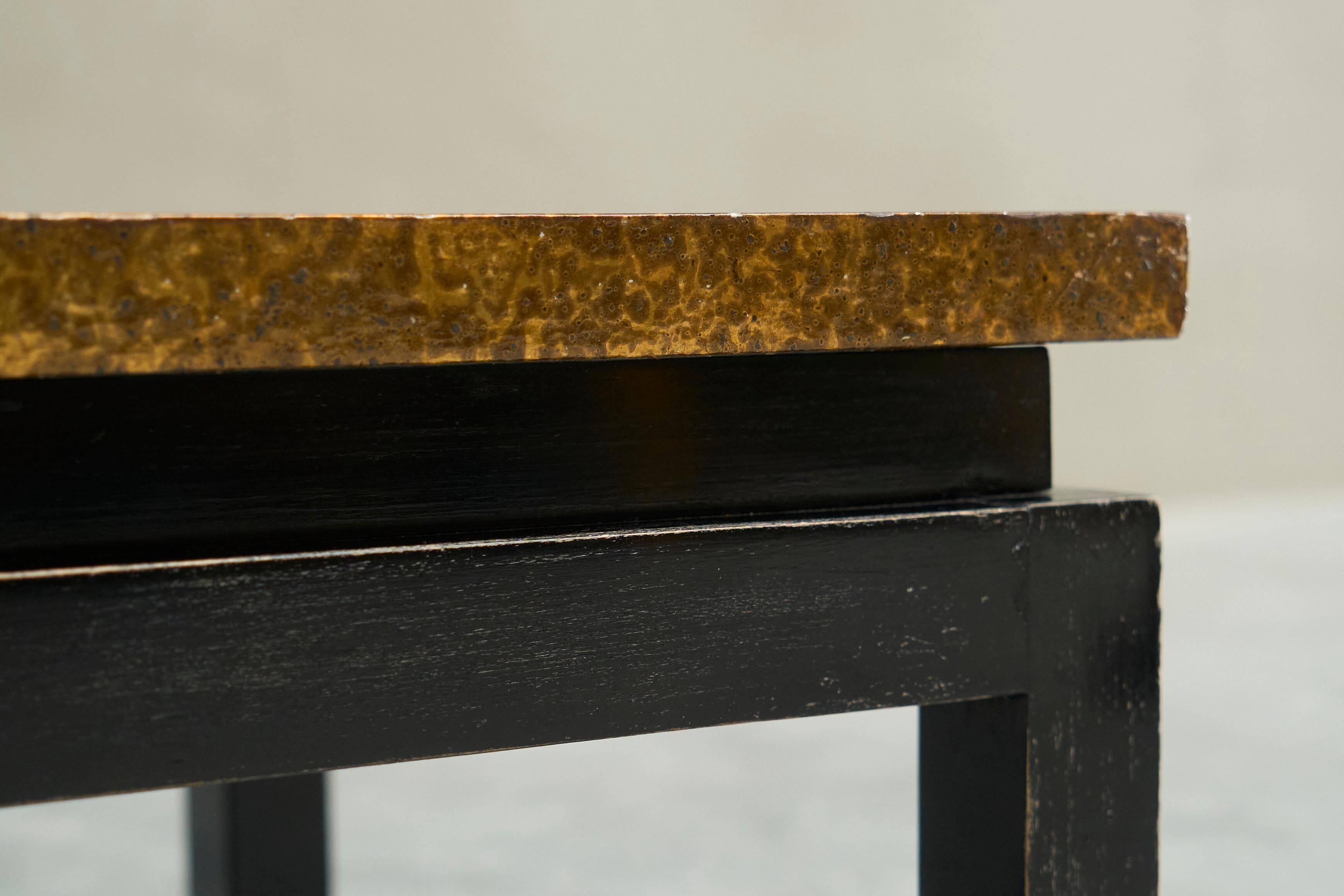 Modernist coffee table with a patinated gold top, 120x52.5x36 cm, mid-20th century.