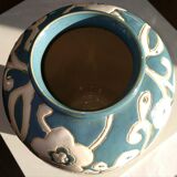 Blue water vase with white floral pattern