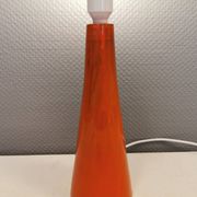 Ceramic table lamp with partial orange glaze.