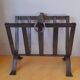 Brutalist magazine rack in forged steel, 1950.