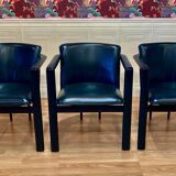 Set of 3 designer leather and metal armchairs.