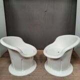 Pair of white plastic armchairs
