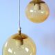 Set of 2 bubbled amber glass globe pendants