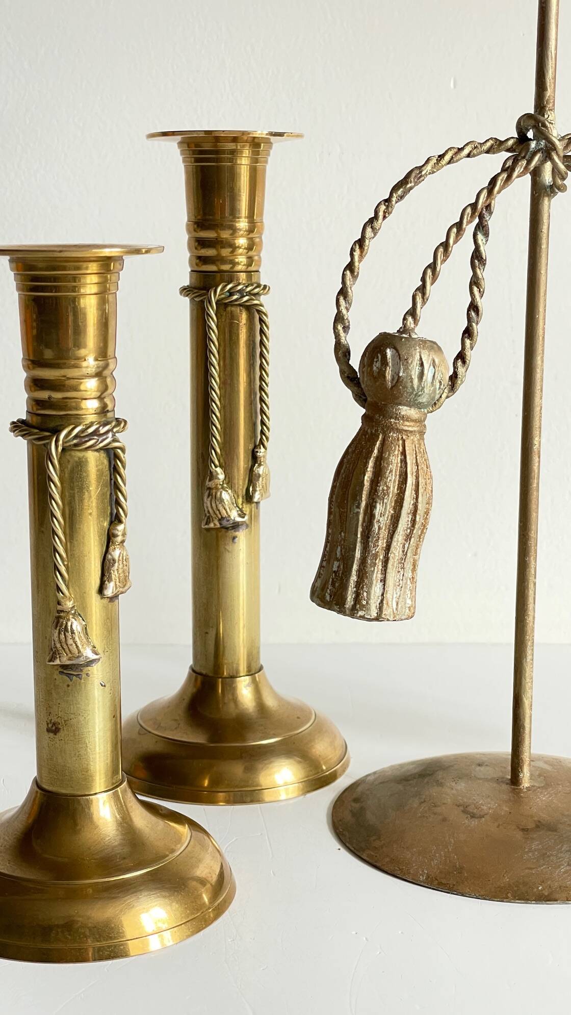Trio of vintage knotted candlesticks brass