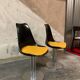 Set of black and yellow tulip chairs