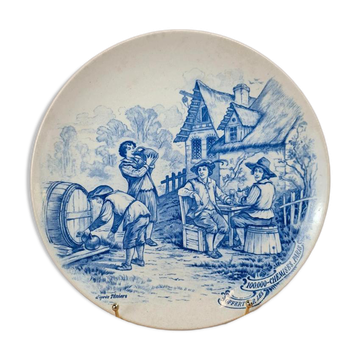 Old advertising plate with blue decoration after Teniers – 100,000 Shirts Paris