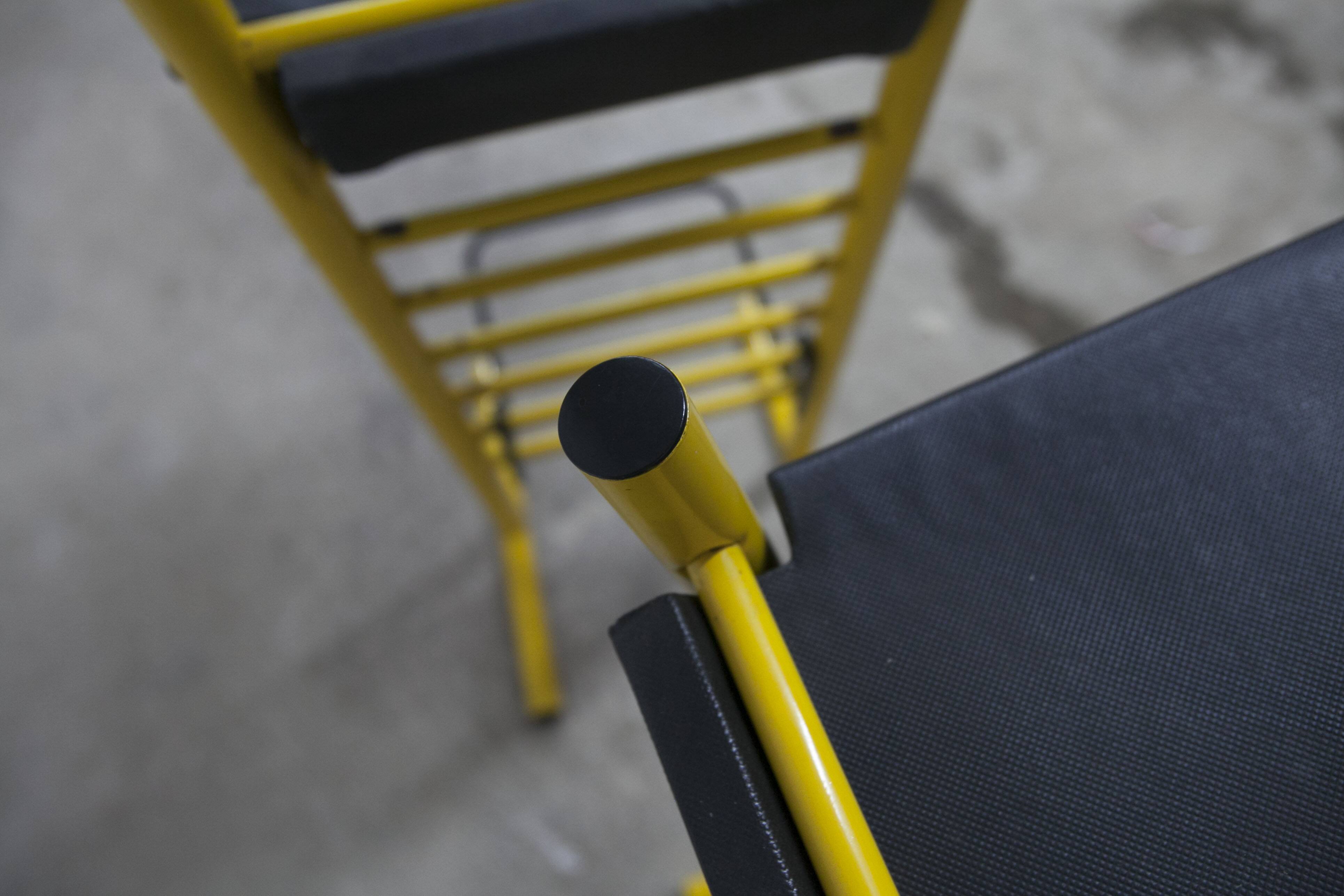 Pair of adjustable Italian bar stools in lacquered yellow and black
