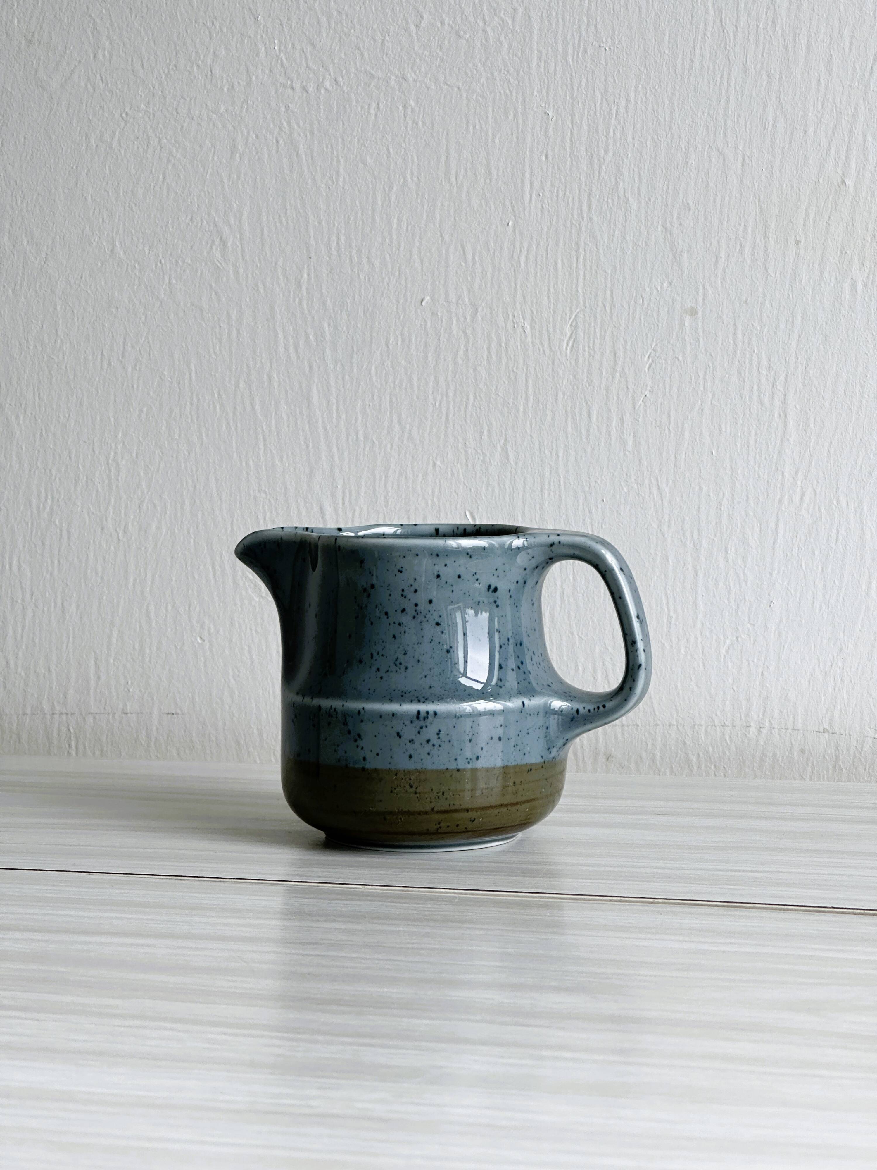 Blue and beige ceramic milk jug