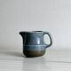Blue and beige ceramic milk jug