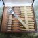 12 old dessert forks in stainless steel and Bakelite