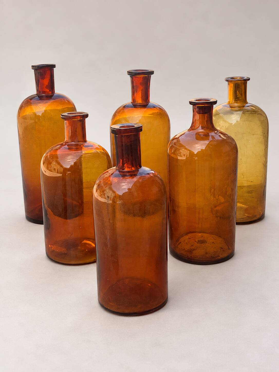 Set of 6 antique amber glass apothecary bottles.