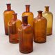 Set of 6 antique amber glass apothecary bottles.