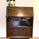 Solid oak secretary with golden feet