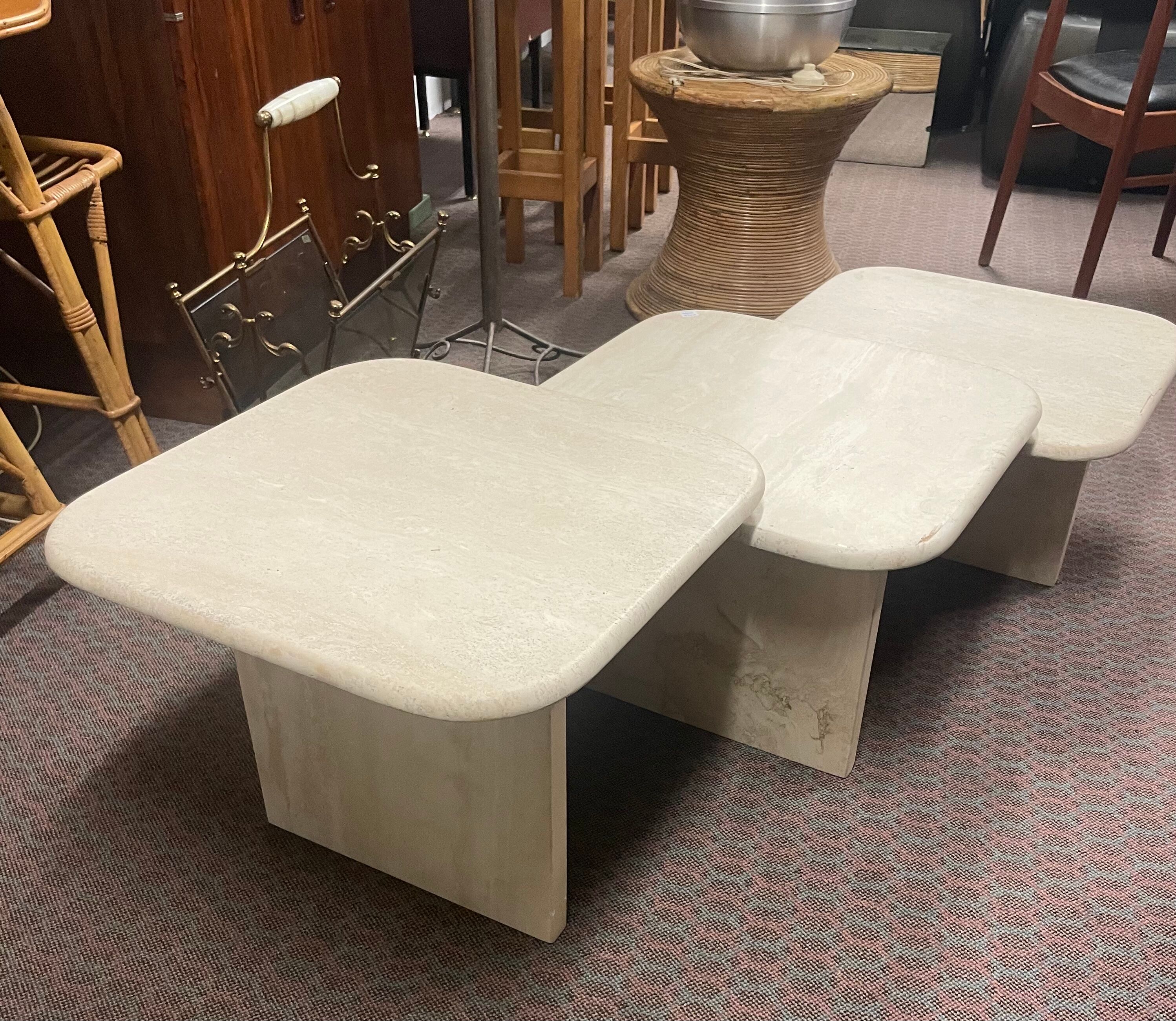 Modular pull-out coffee tables in travertine