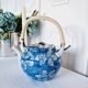 Handcrafted Japanese porcelain teapot hand painted in blue and white.