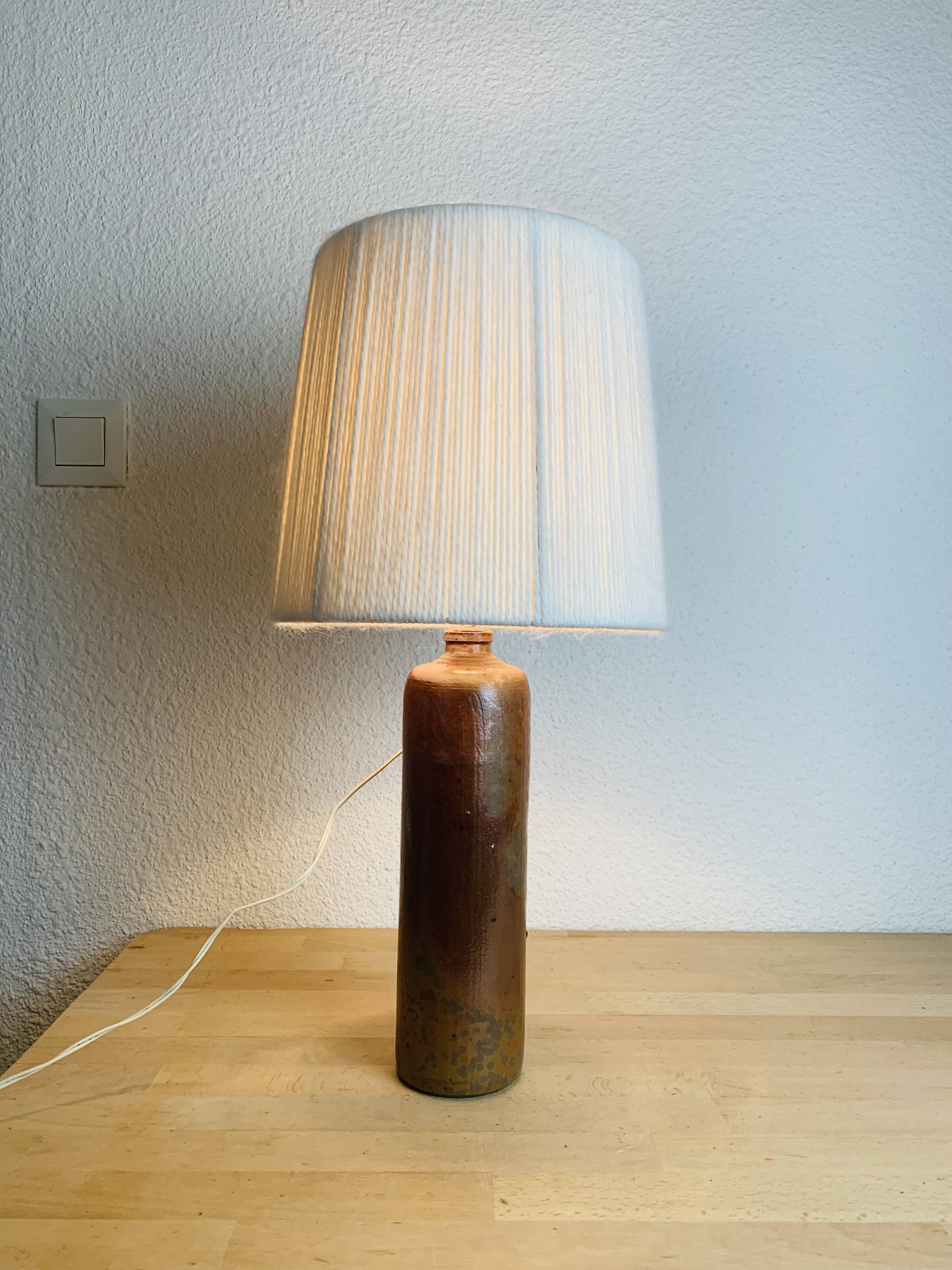 Stoneware bottle lamp and vintage wool lampshade