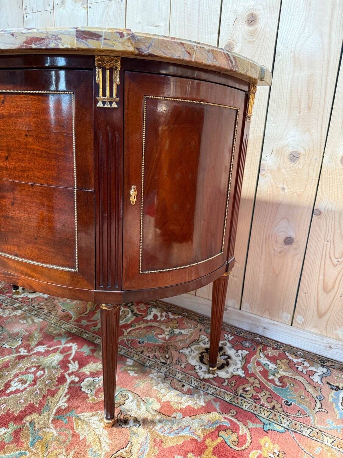 Louis XVI half-moon commode in mahogany and marble