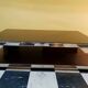 Designer coffee table in glass and chrome metal.