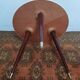 Vintage tripod side table in wood and formica.