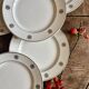 Set of 10 vintage white and gold dessert plates.