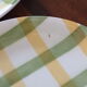 6 green and yellow checkered plates, tea towel