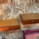 Suspended teak bedside tables in vintage 1960s Scandinavian style.