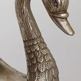 Metal swan emptier
