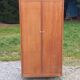 Vintage oak wardrobe with metal legs from the 1950s.