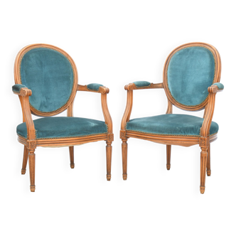 Pair of Louis XVI style convertible armchairs