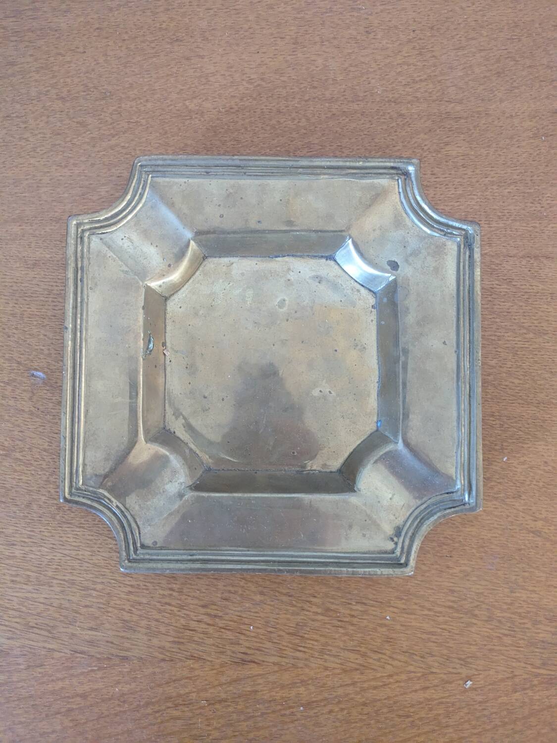 Brass pocket emptier