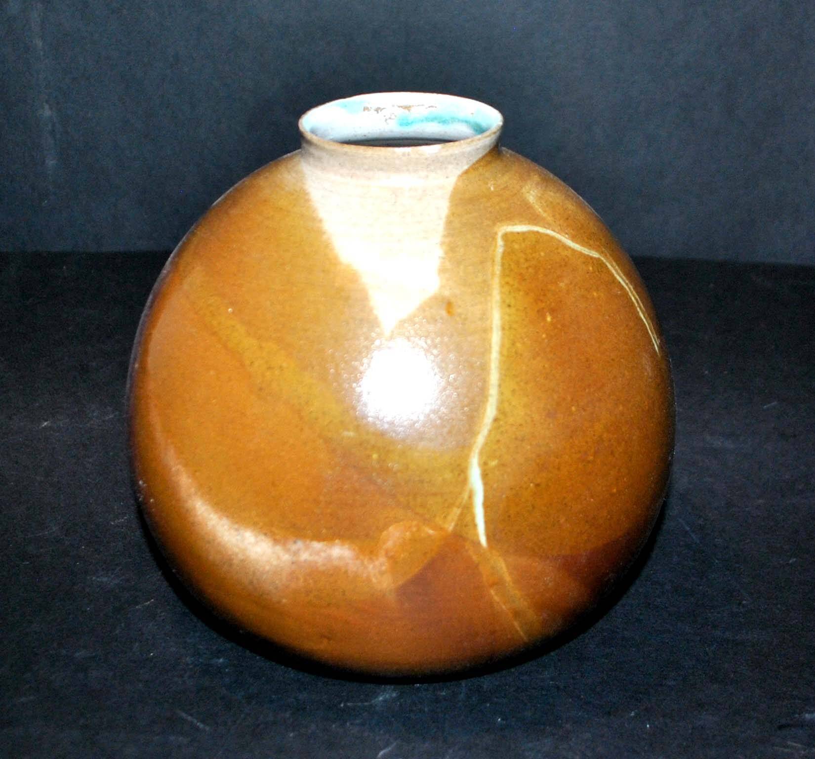 Vintage ball vase in flamed stoneware 1960 - caramel color with blue flow - signed DS