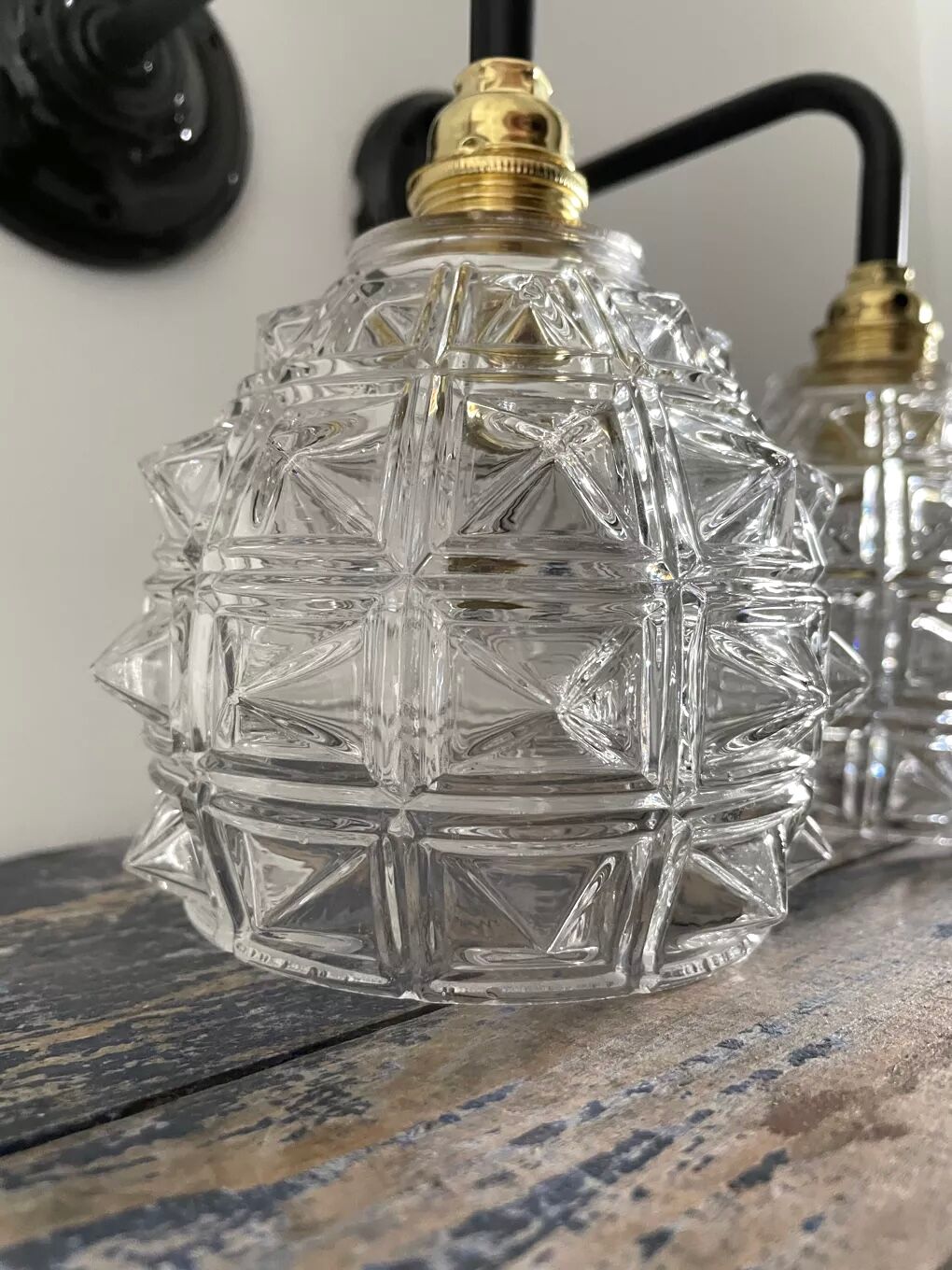 Set of two chiseled glass sconces
