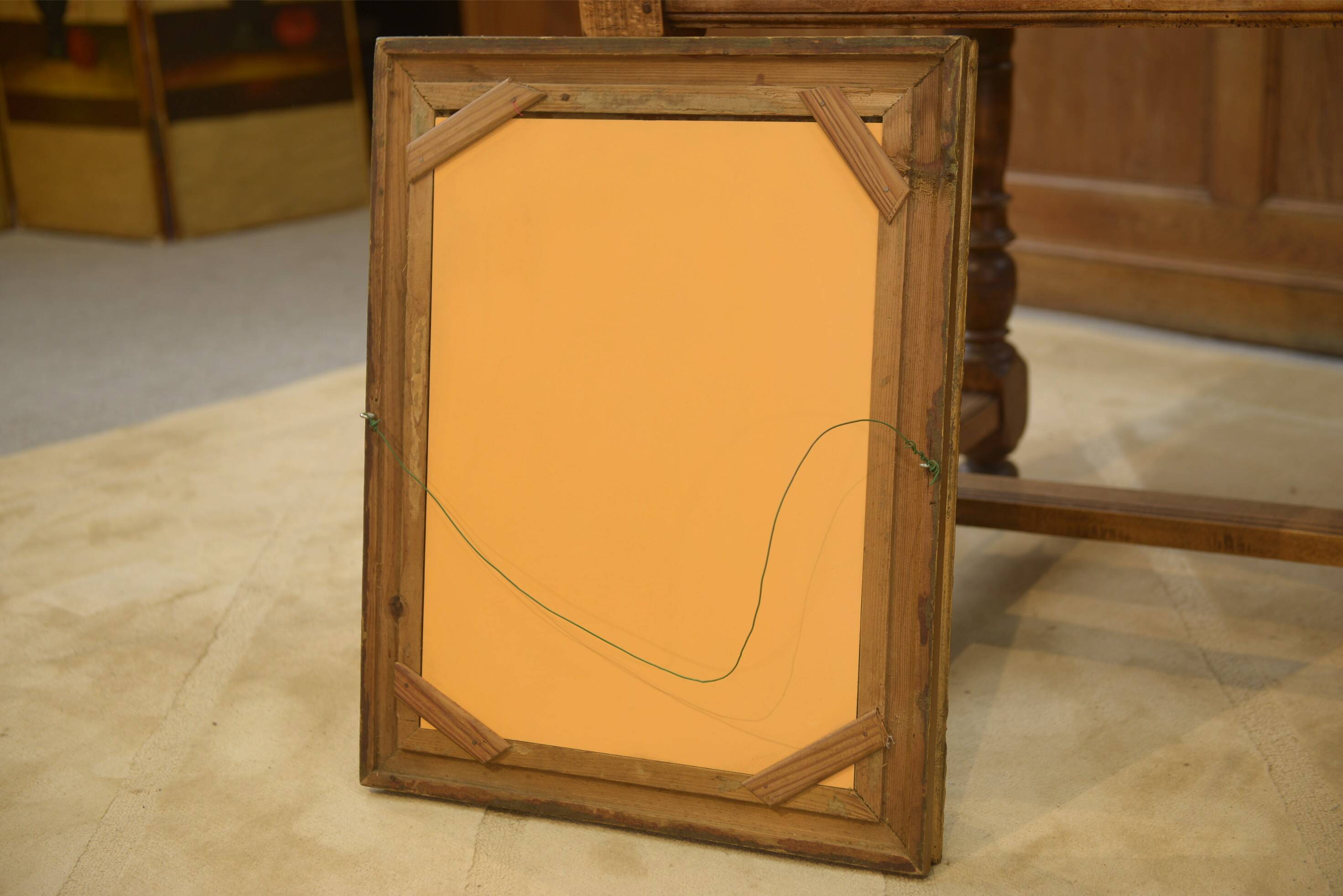 19th-century mirror in wood and stucco with floral decoration.
