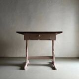 Rustic pink painted desk with brown tabletop