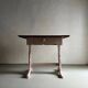 Rustic pink painted desk with brown tabletop