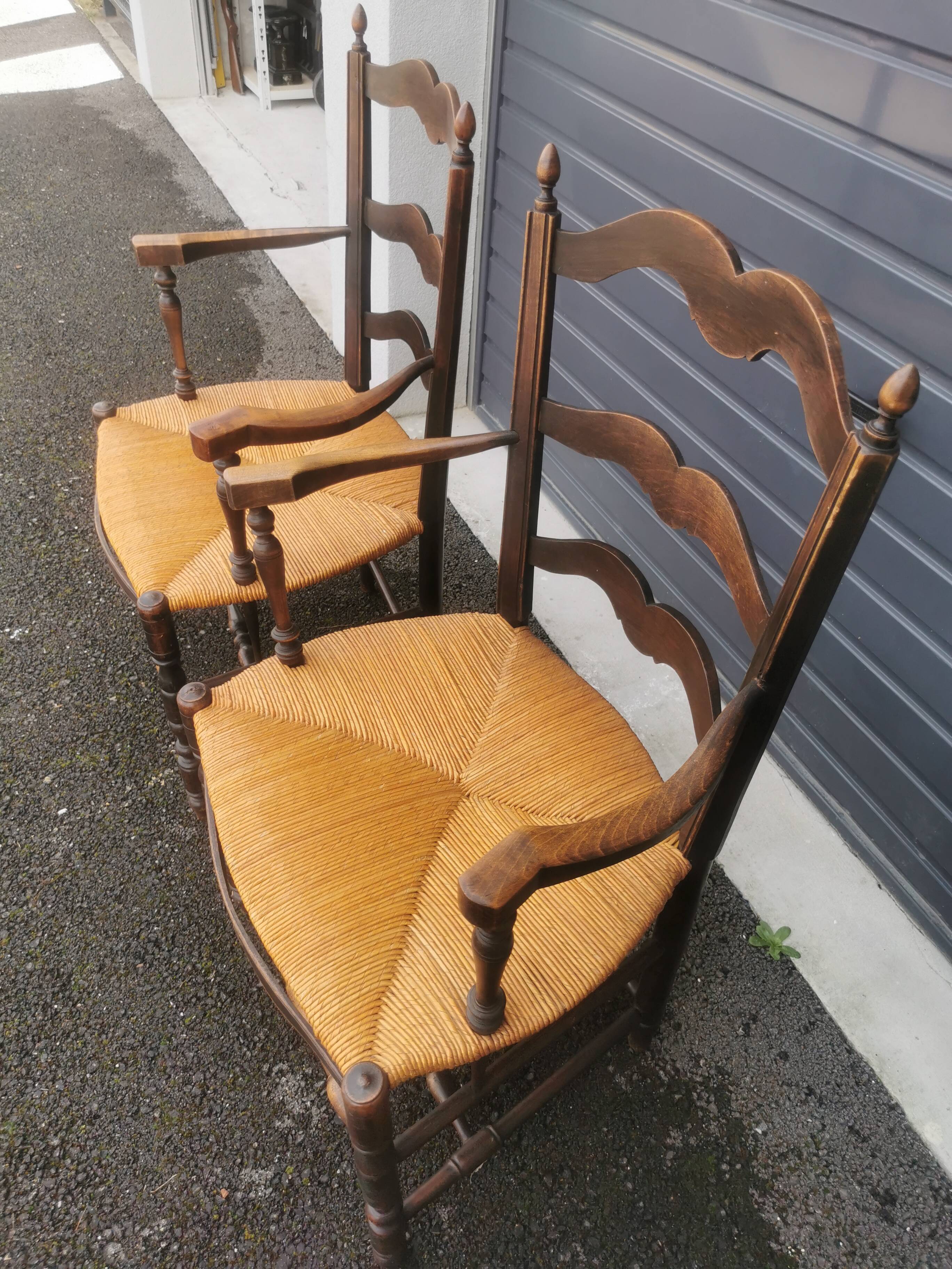 Pair of blackened wooden armchairs
