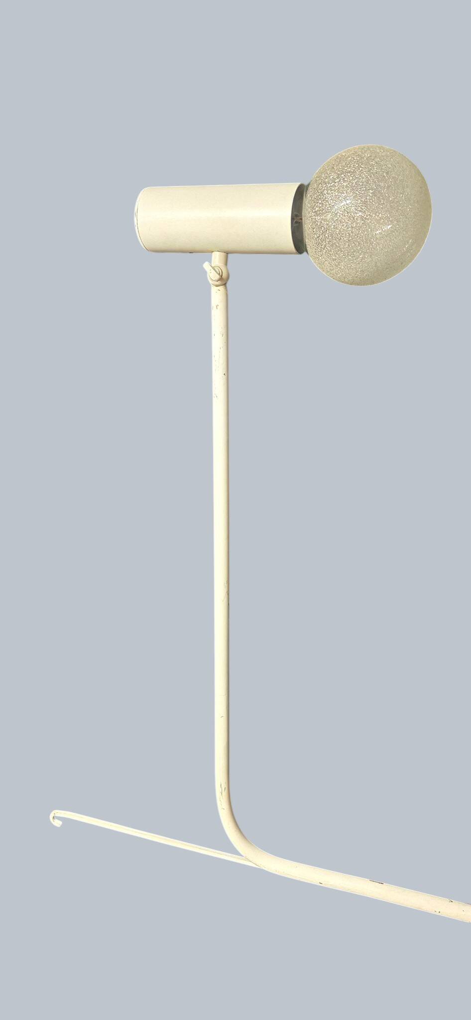 Minimalist metal wall light in the style of Jean Prouvé, circa 1950.