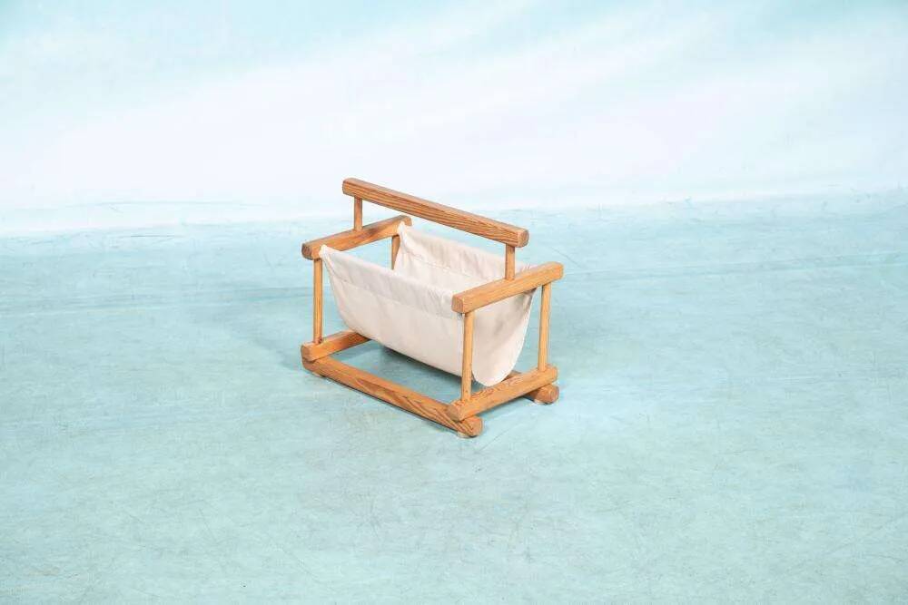 Bohemian magazine rack in vintage 70s pine style.