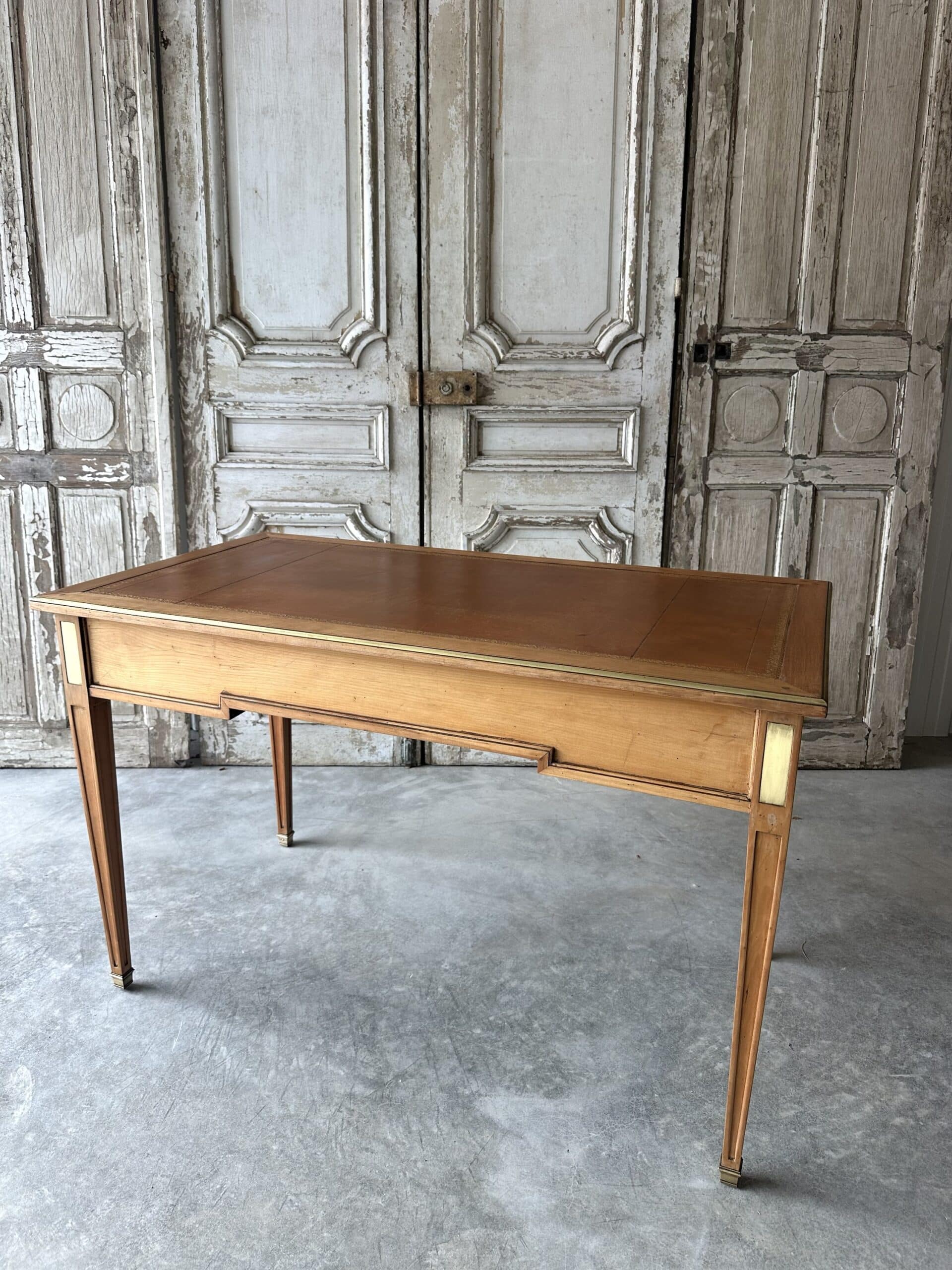 Directoire style flat desk circa 1960 in light cherry wood.