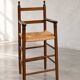 High chair made of straw and wood